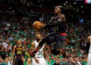 Apr 22, 2016; Boston, MA, USA; Atlanta Hawks guard Dennis Schroder (17) shoots against Boston Celtics guard Marcus Smart (36) during the third quarter in game three of the first round of the NBA Playoffs at TD Garden. Mandatory Credit: David Butler II-USA TODAY Sports