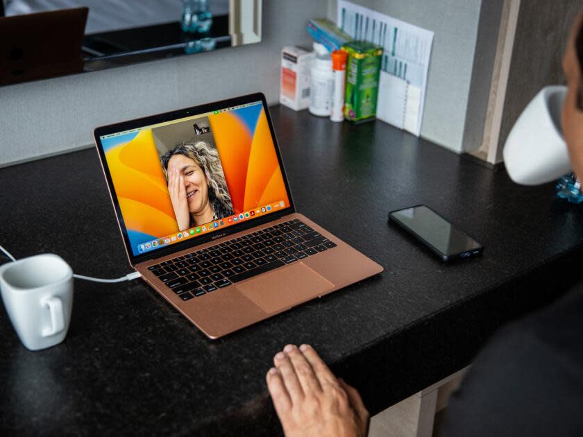 A man talks with his wife via Facetime.