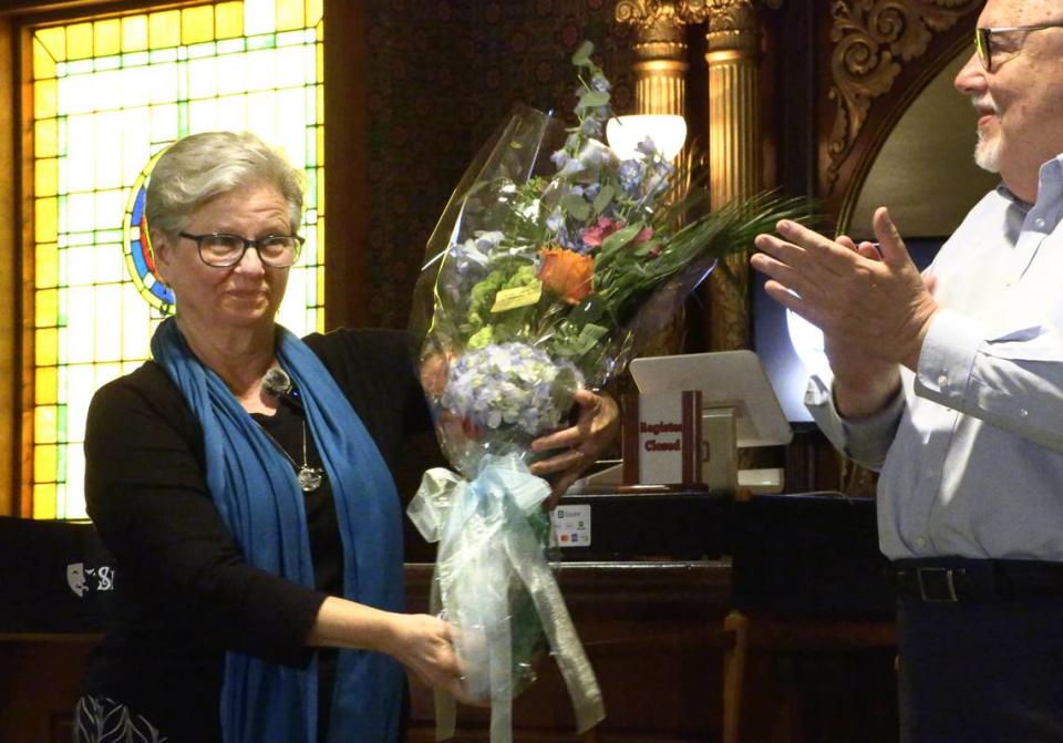 Debbie Anderson receives flowers at the “Springer Unplugged” event on Friday, April 26, 2024 after it was announced she is retiring as the Springer’s musical director. 04/26/2024 Mike Haskey/mhaskey@ledger-enquirer.com