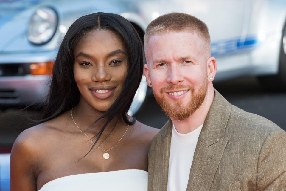 Chyna Mills wears white alongside her love Neil Jones