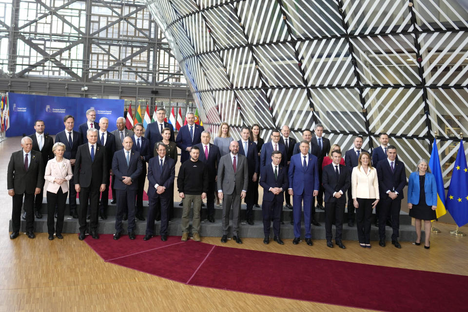 Ukraine's President Volodymyr Zelenskyy, front center left, and European Council President Charles Michel, front center right, pose with other European Union leaders during a group photo at an EU summit in Brussels on Thursday, Feb. 9, 2023. European Union leaders are meeting for an EU summit to discuss Ukraine and migration. (AP Photo/Virginia Mayo)