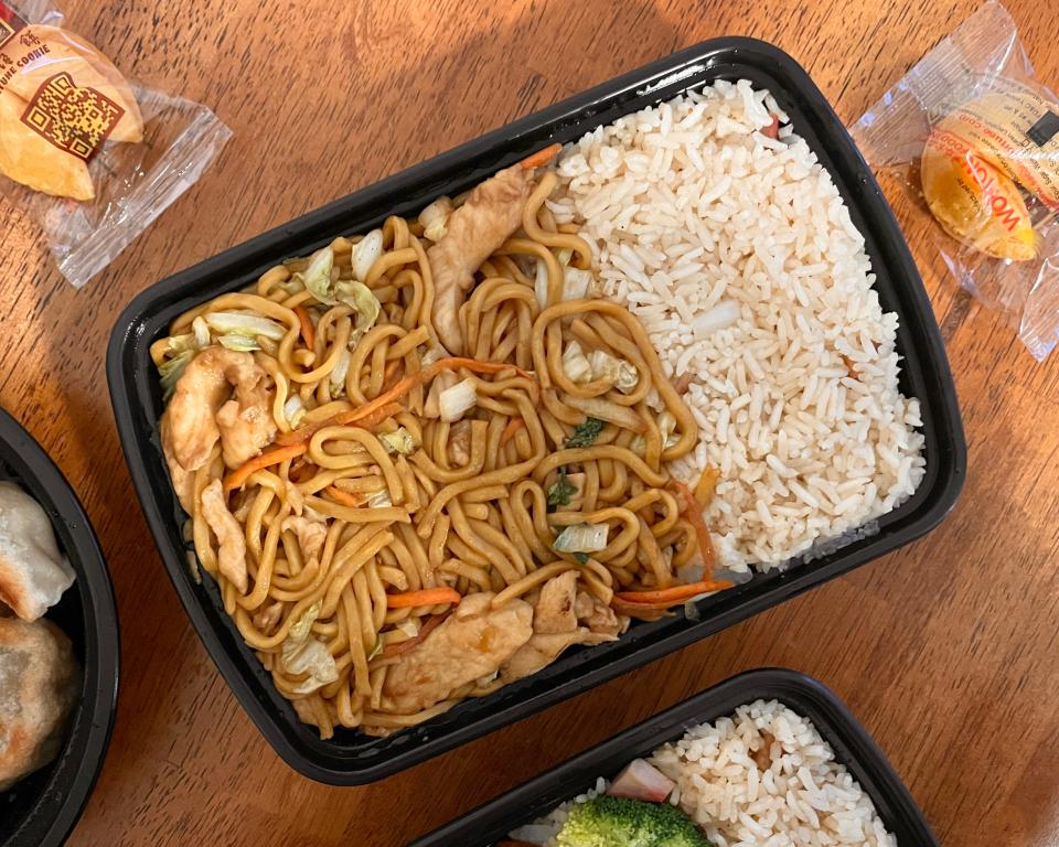 The chicken lo mein combo features lo mein noodles coated in a rich sauce, with juicy chicken, veggies and cabbage throughout with pork fried rice and a pork egg roll.