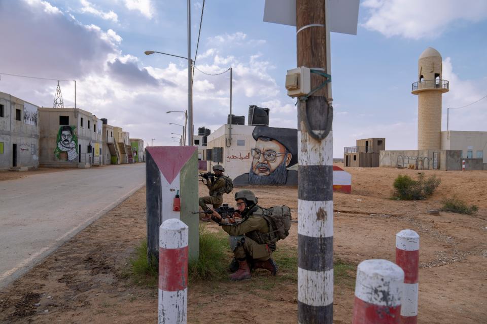 Israeli soldiers participate in a training session simulating urban warfare at the Zeelim army base, southern Israel, Jan. 4, 2022.