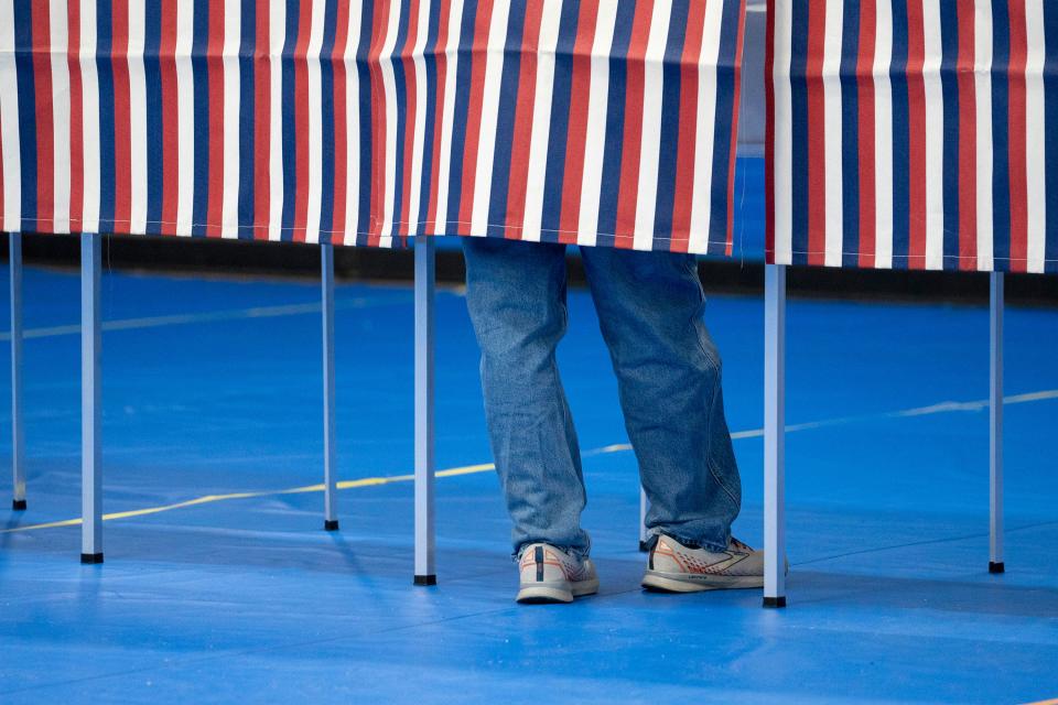 A voter casts a ballot in the New Hampshire presidential primary at the Green Street Community Center in Concord, NH, on Tuesday, January 23, 2024.