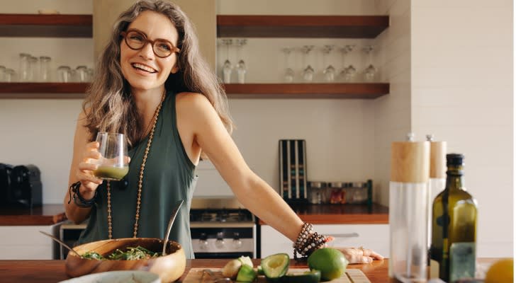 woman cooking in retirement with $8 million