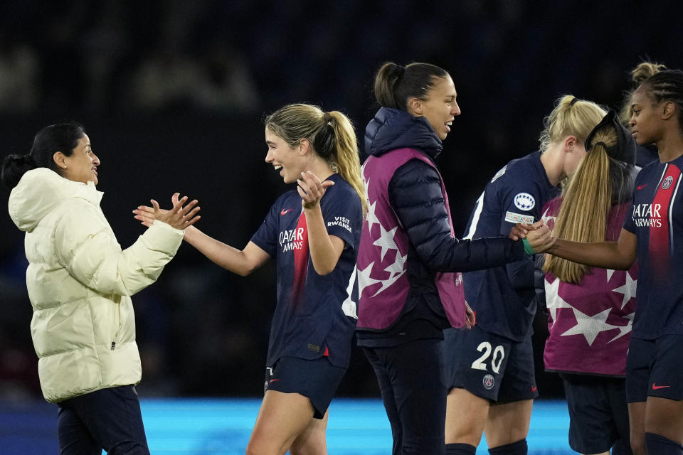 PSG's Korbin Albert, 2nd left, and her teammates celebrate at the end of the women's Champions League quarterfinals, second leg, soccer match between Paris Saint-Germain and BK Hacken at Parc des Princes, in Paris, Thursday, March 28, 2024. PSG won 3-0. (AP Photo/Thibault Camus)