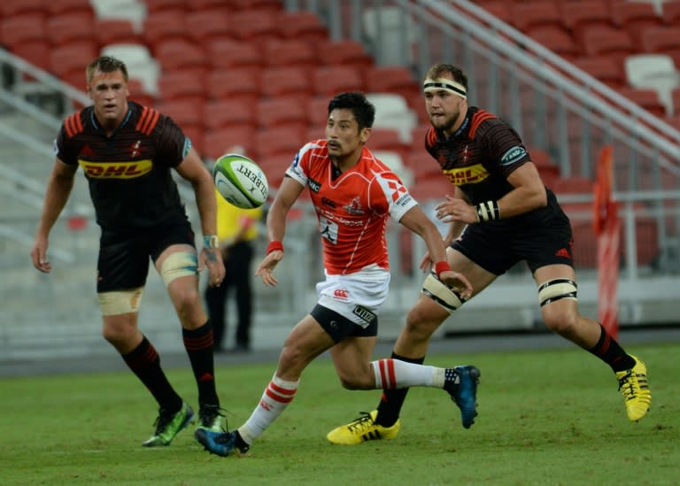 Keisuke Uchida (C) of Sunwolves collects a pass during their Super Rugby match against the Stormers in Singapore