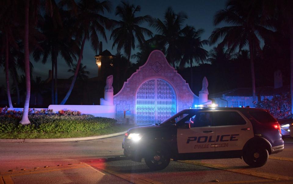 Authorities outside Mar-a-Lago, the residence of former president Donald Trump, as the FBI execute a search warrant in Palm Beach, Florida - JIM RASSOL/EPA-EFE/Shutterstock