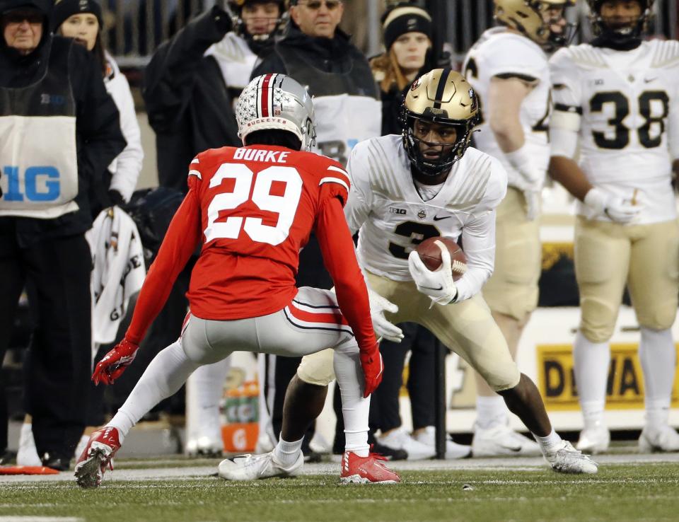Purdue Boilermakers wide receiver David Bell (3) makes a catch against Ohio State Buckeyes cornerback Denzel Burke (29) during the 2nd quarter of their NCAA game at Ohio Stadium in Columbus, Ohio on November 13, 2021. 