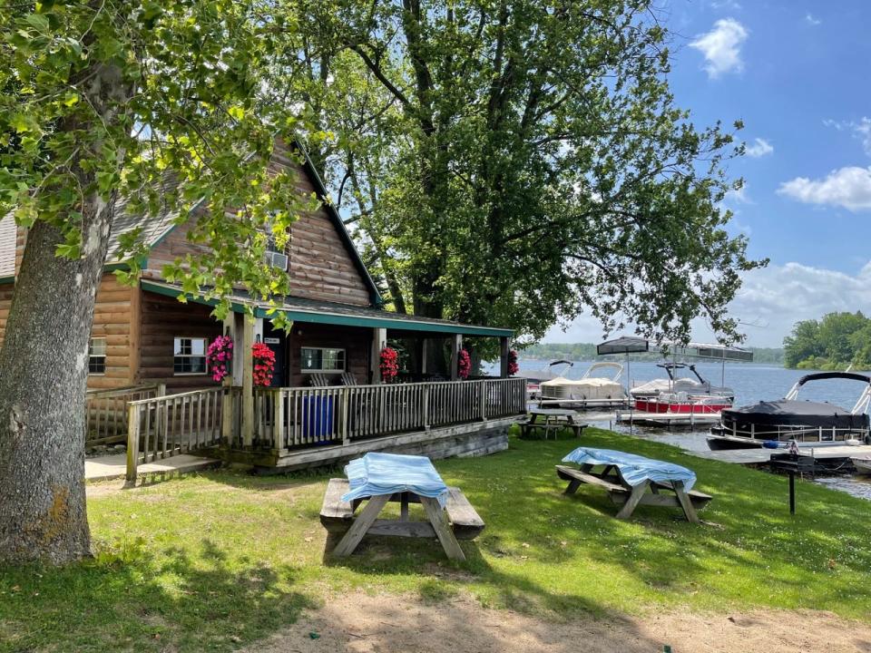 The big cabin and picnic grill area are pictured at Evans Lake Resort in Tipton.