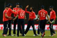 Cricket - South Africa v England - World Twenty20 cricket tournament - Mumbai, India, 18/03/2016. England's Moeen Ali (C) celebrates with his teammates after taking the wicket of South Africa's Quinton de Kock. REUTERS/Danish Siddiqui