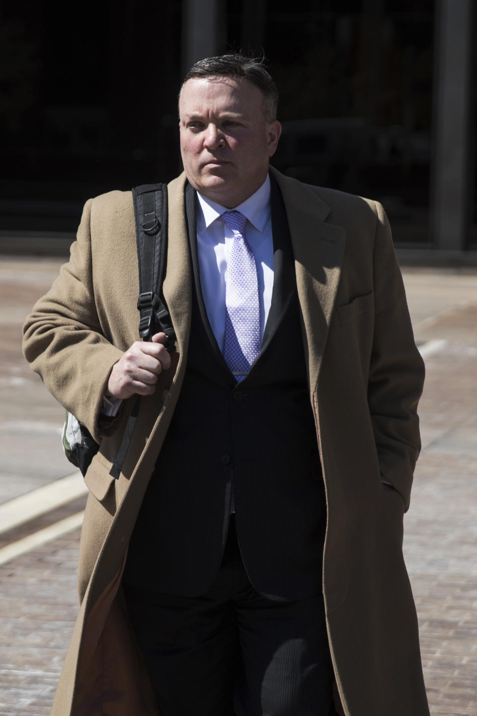 Former Allentown Managing Director Francis Dougherty walks from the federal building, Wednesday, March 22, 2017, in Philadelphia. The former top administrator in Allentown, Pa., has pleaded guilty in an ongoing FBI pay-to-play corruption probe. (AP Photo/Matt Rourke)