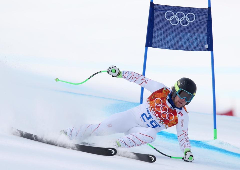 United States' Andrew Weibrecht passes a gate in the men's super-G at the Sochi 2014 Winter Olympics, Sunday, Feb. 16, 2014, in Krasnaya Polyana, Russia. (AP Photo/Alessandro Trovati)