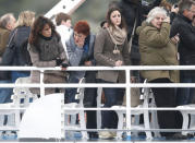 Relatives of victims cry as they stand on a ferry during a ceremony to commemorate the first anniversary of the Costa Concordia shipwreck, in which 32 people died, outside Giglio harbour January 13, 2013. REUTERS/Tony Gentile