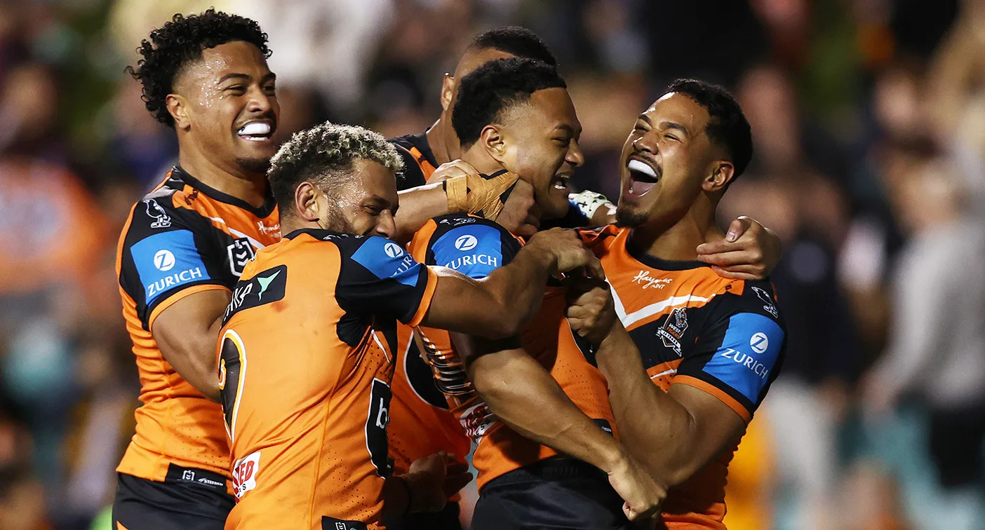 Seen here, Wests Tigers players celebrate during an NRL win over Manly.