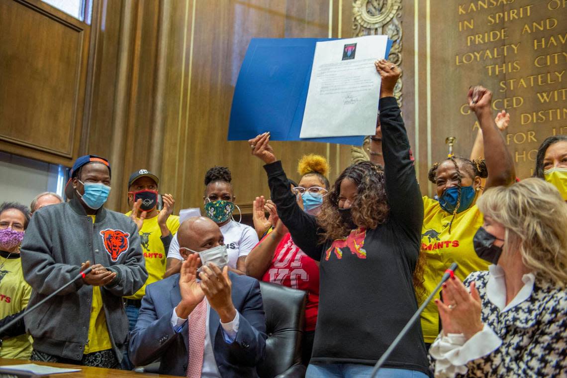 KC Tenants members celebrated after Kansas City Mayor Quinton Lucas signed the Tenants’ Right to Counsel legislation at Kansas City City Hall on Dec. 20, 2021.