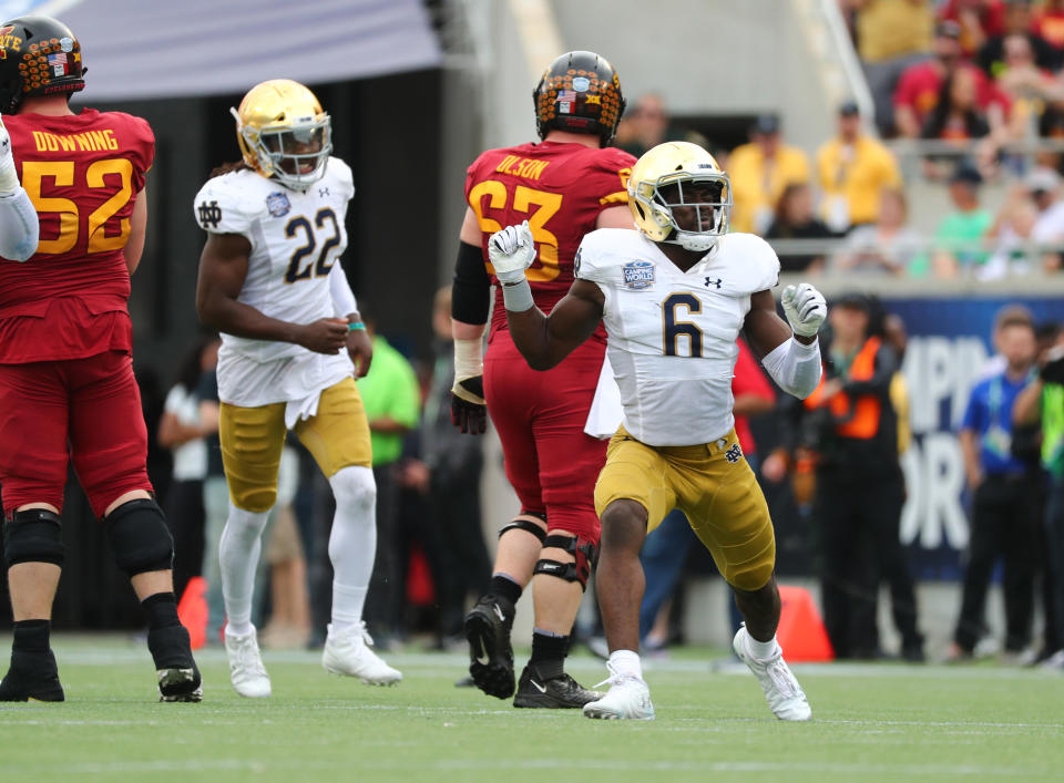 Dec 28, 2019; Orlando, Florida, USA; Notre Dame Fighting Irish linebacker Jeremiah Owusu-Koramoah (6) celebrates his sack on Iowa State Cyclones quarterback Brock Purdy (15) (not pictured) during the second half at Camping World Stadium. Mandatory Credit: Kim Klement-USA TODAY Sports