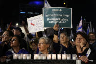 Israelis protest against the plans by Prime Minister Benjamin Netanyahu's new government to overhaul the judicial system, in Tel Aviv, Israel, Saturday, Jan. 28, 2023. (AP Photo/Tsafrir Abayov)