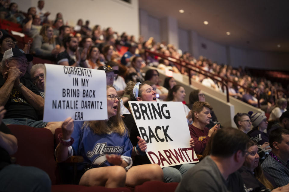 Fans Tina Frederickson and Lisa Fulton hold signs about the removal of general manager Natalie Darwitz from PWHL Minnesota, during the PWHL hockey draft in St. Paul, Minn., Monday June, 10, 2024. (Renée Jones Schneider/Star Tribune via AP)