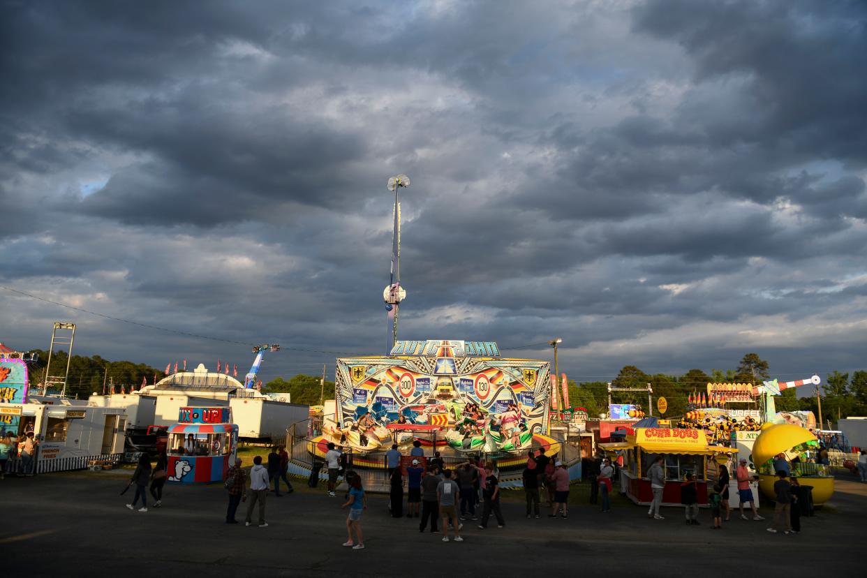 The sun sets at the Columbia County Spring Fair at the Columbia County Fairgrounds in Grovetown, Ga., on Wednesday, April 24, 2024. Hosted by the Merchants Association of Columbia County, the spring fair will run through April 28th.