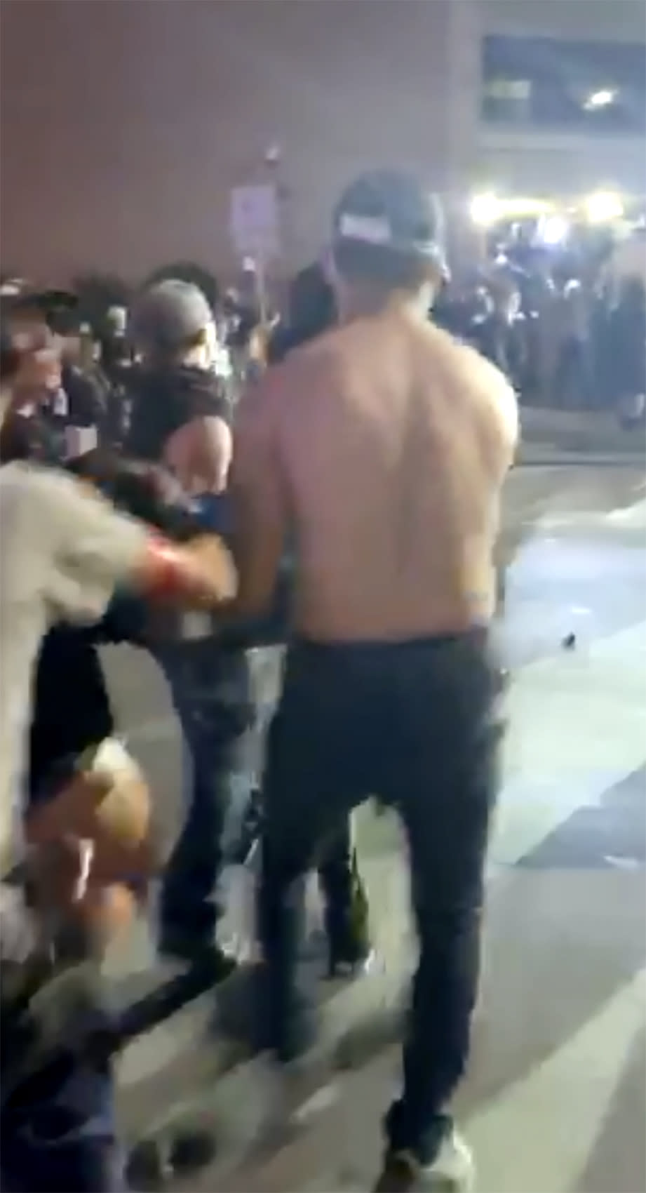 This still image taken from video provided by David Frost shows protesters carrying Justin Howel, injured during a protest against police brutality in front of the Austin Police Department Headquarters on May 31, 2020 in Austin, Texas. A beanbag cracked Howell's skull and, according to his family, damaged his brain. In some instances, police reacted with force so extreme that while their intent may not be to kill, the effects were devastating. (David Frost via AP)