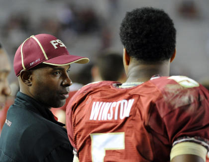 Charlie Ward talks to FSU QB Jameis Winston during a game. (USAT)