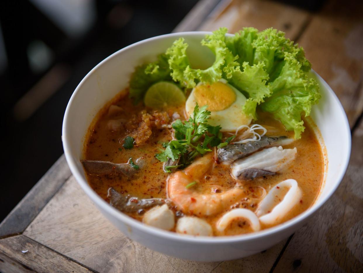 Authentic Thai Tomyum soup noodles with seafood and egg