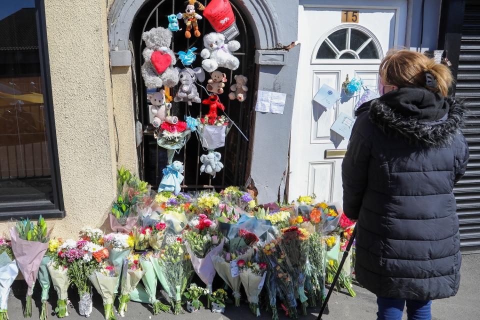 Floral tributes were left at the scene where the baby's pram was hit by a car (SWNS)