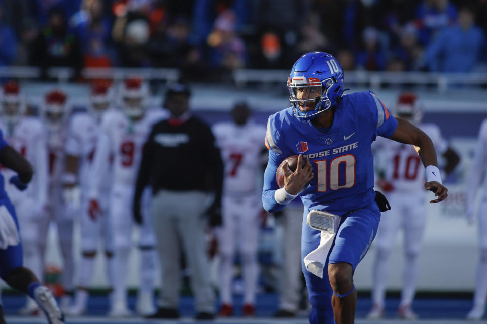 Boise State quarterback Taylen Green (10) runs the ball against Fresno State during the first half of an NCAA college football game for the Mountain West championship, Saturday, Dec. 3, 2022, in Boise, Idaho. (AP Photo/Otto Kitsinger)
