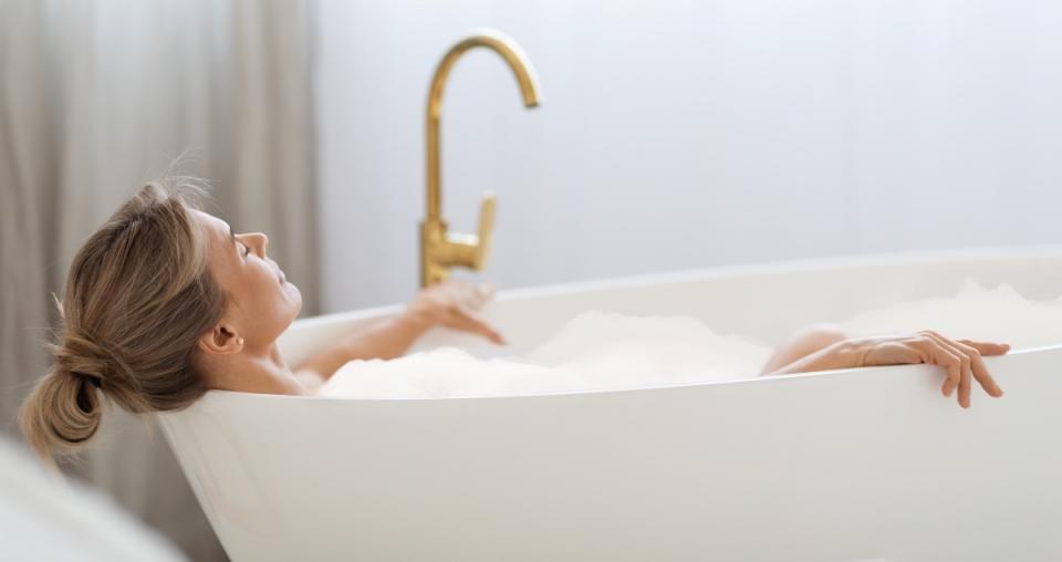 Woman taking a bath to prevent a stroke