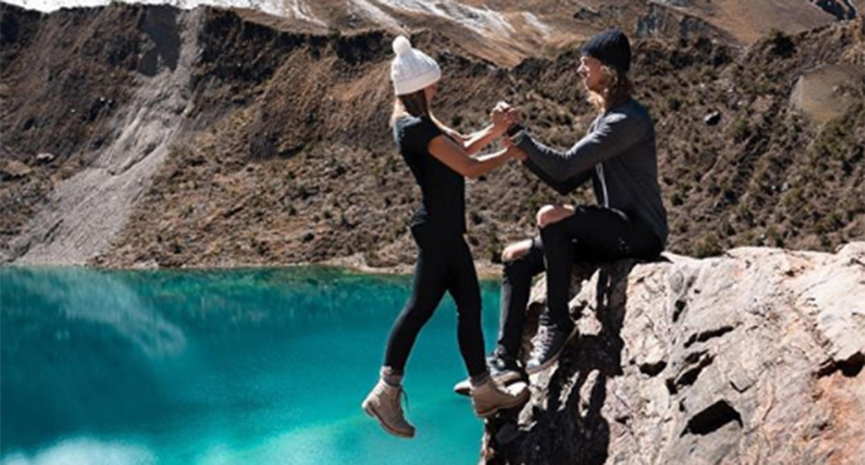 Instagram travelling couple  Kelly Castille and Kody Workman show off thier latest risky upload with Ms Castille dangling from a cliff with one foot while Mr Workman hangs on.