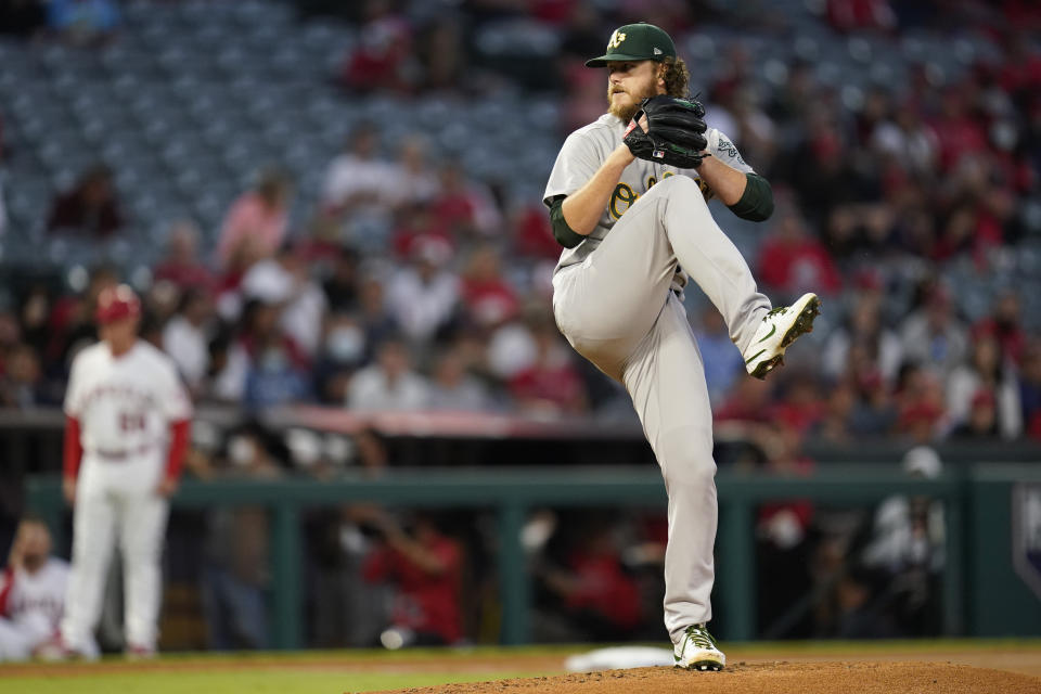 Oakland Athletics starting pitcher Cole Irvin (19) throws during the first inning of a baseball game against the Los Angeles Angels Friday, Sept. 17, 2021, in Anaheim, Calif. (AP Photo/Ashley Landis)