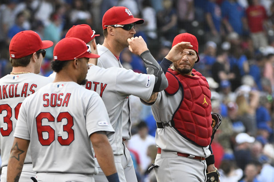 St. Louis Cardinals catcher Yadier Molina, right, celebrates with teammates at the end of a baseball game against the Chicago Cubs, Friday, Sept. 20, 2019, in Chicago. (AP Photo/Matt Marton)