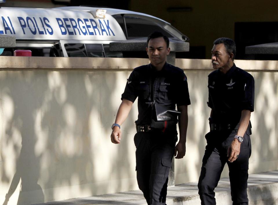 Police officers patrol outside the forensic department at Kuala Lumpur Hospital in Kuala Lumpur, Malaysia, Saturday, Feb. 25, 2017. According to police Friday, forensics stated that the banned chemical weapon VX nerve agent was used to kill Kim Jong Nam, the North Korean ruler's outcast half brother who was poisoned last week at the airport. (AP Photo/Daniel Chan)