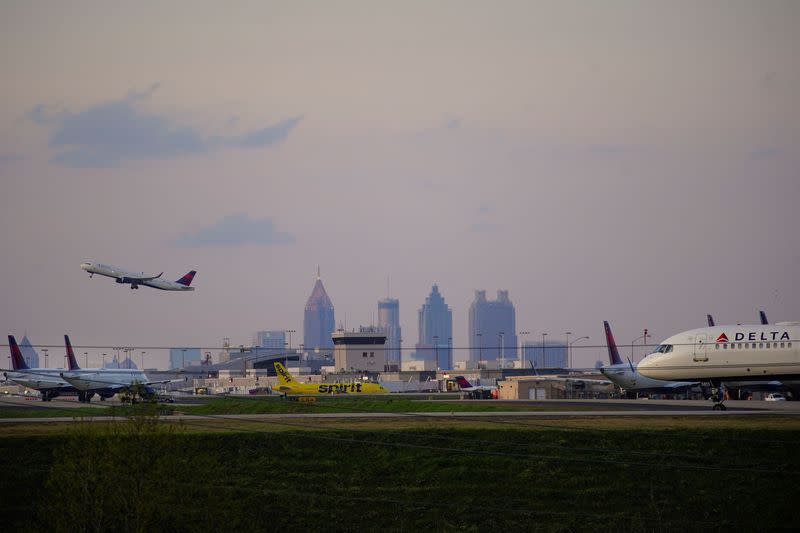 FILE PHOTO: Delta Air Lines passenger planes crowd a runway in Atlanta