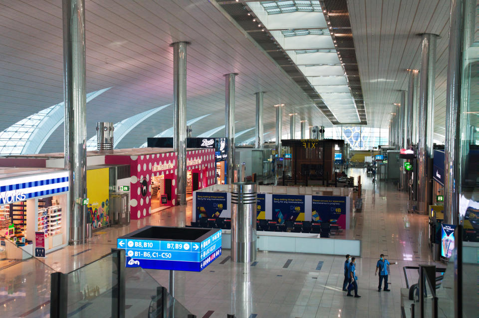 Dubai International Airport's Terminal 3, typically buzzing with passengers, stands largely empty in Dubai, United Arab Emirates, Wednesday, June 10, 2020. The coronavirus pandemic has hit global aviation hard, particularly at Dubai International Airport, the world's busiest for international travel, due to restrictions on global movement over the virus. (AP Photo/Jon Gambrell)