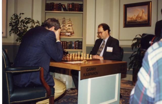 World chess champion Garry Kasparov walks around the playing room as he  waits for IBM's Deep Blue chess playing computer to make its next move  during the third game of their six