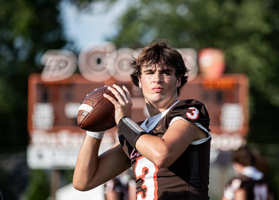 DeSales senior quarterback Peyton Molter (3) warmed up before taking on KCD at Paul B. Cox Stadium on Friday, Sept. 1, 2023.