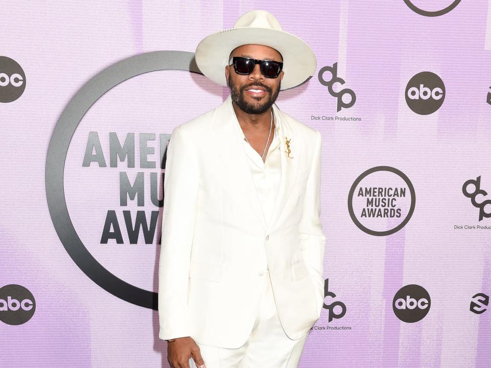 D-Nice in an all-white suit and white hat