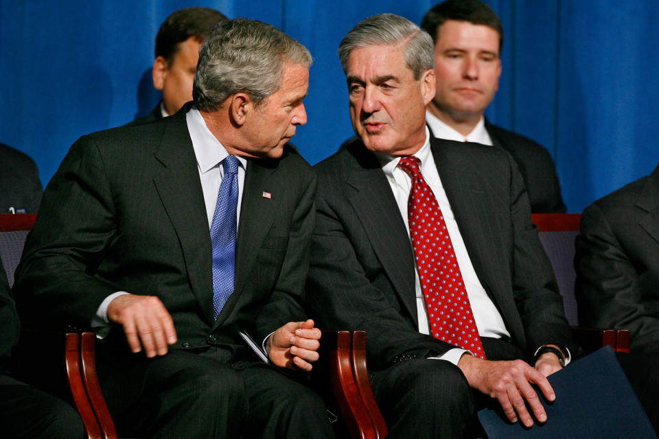 <p>President Bush, left, speaks with FBI Director Robert Mueller during a graduation ceremony for new FBI agents, Thursday, Oct. 30, 2008, at the FBI Academy in Quantico, Va. (Photo: Jacquelyn Martin/AP) </p>