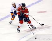 Nov 10, 2018; Sunrise, FL, USA; Florida Panthers center Aleksander Barkov (16) skates with the puck past New York Islanders center Mathew Barzal (13) in the third period at BB&T Center. Robert Mayer-USA TODAY Sports