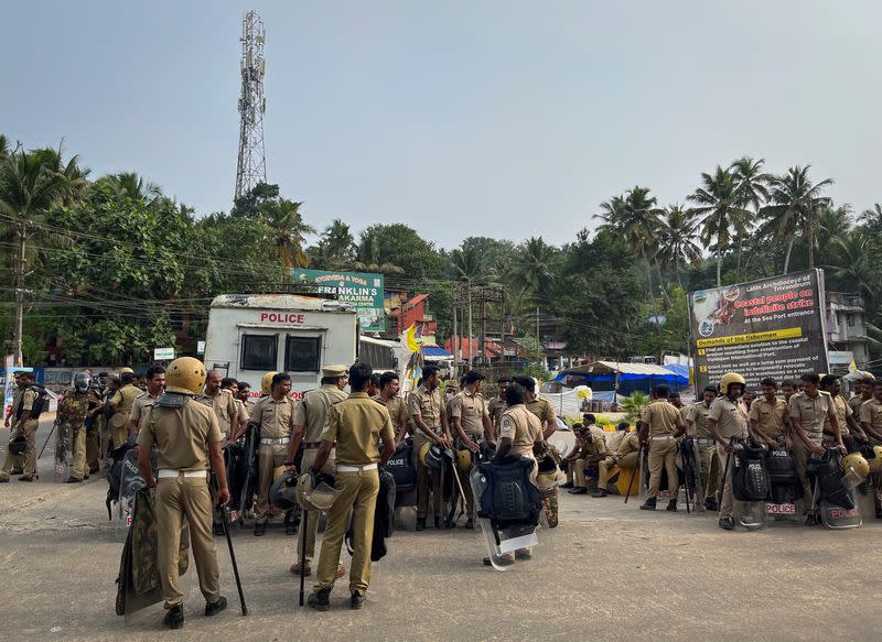 Members of police arrive at a protest site ahead of a rally by the supporters of the proposed Vizhinjam port project