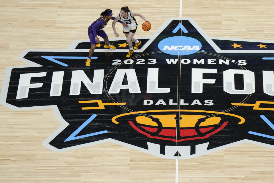 Apr 2, 2023; Dallas, TX, USA; LSU Lady Tigers forward LaDazhia Williams (0) defends as Iowa Hawkeyes guard Caitlin Clark (22) controls the ball in the first half during the final round of the Women's Final Four NCAA tournament at the American Airlines Center. Mandatory Credit: Kirby Lee-USA TODAY Sports