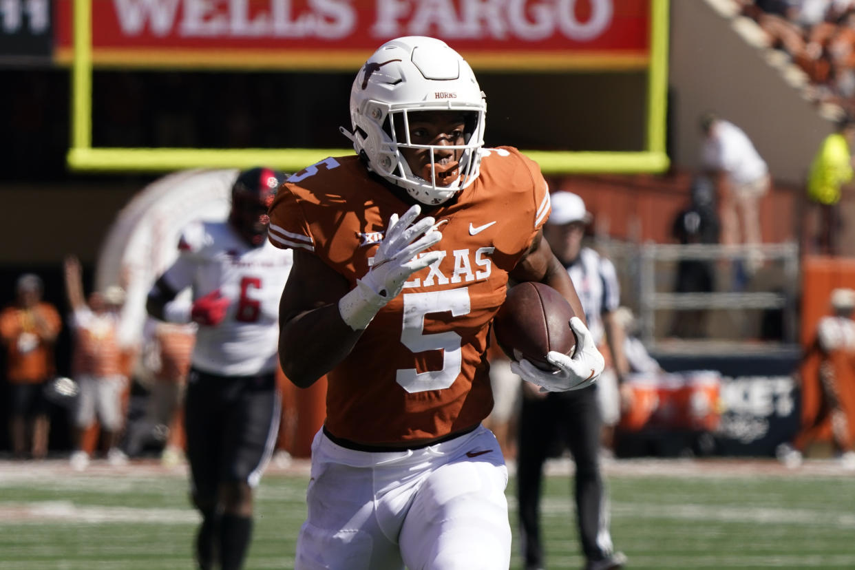 Texas running back Bijan Robinson (5) is one of the best in the country, and he'll play a big role in the Longhorns' quest for a rebound 2022 season. (AP Photo/Chuck Burton)