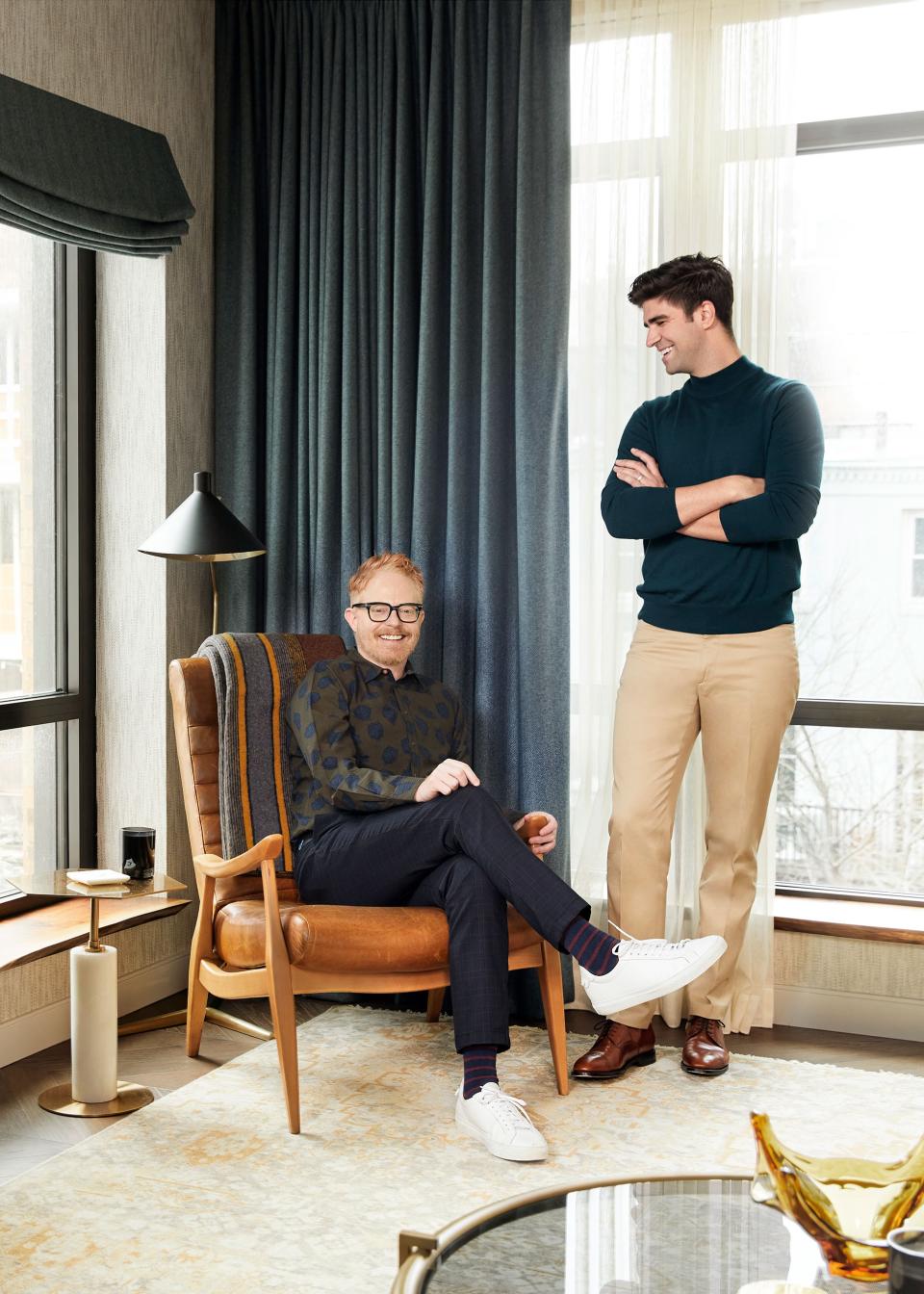 Ferguson (seated) and Mikita pose in their living room. The leather chair is from their previous apartment and was purchased at ABC Carpet & Home.