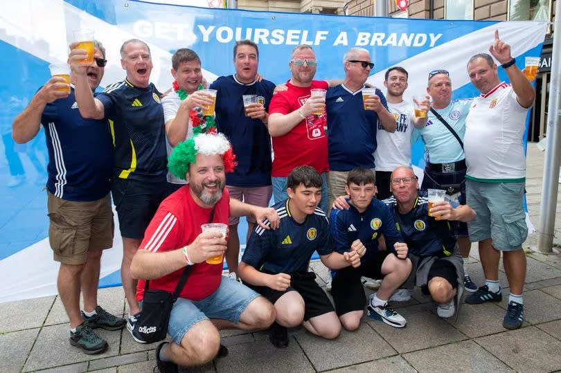 Martin Macleod, pictured fourth from left at the back, with the Tartan Army and Hungary fans