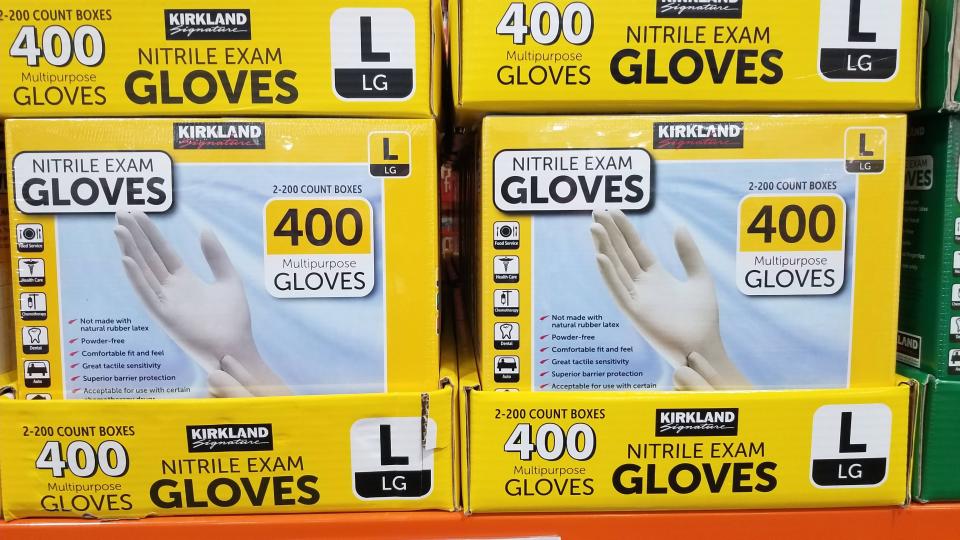 Kirkland gloves in boxes on display at a Costco 