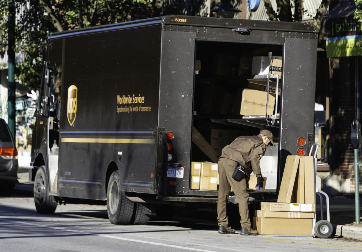 A UPS driver making deliveries in downtown Traverse City, Michigan. (Photo: Getty)