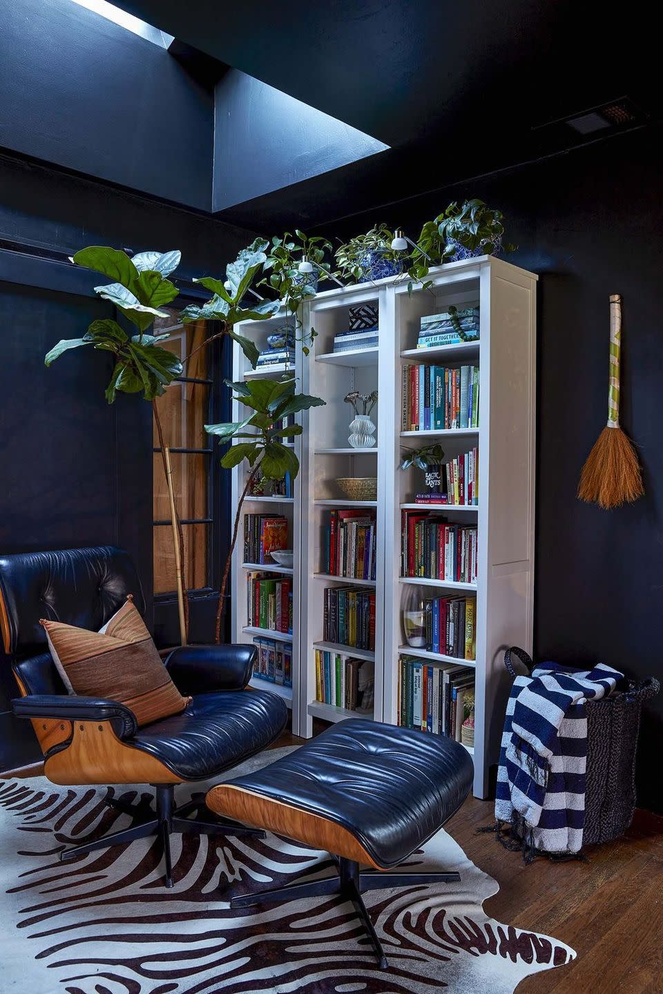 a room with a bookcase and a chair