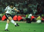 FILE - In this June 26, 1996 file photo Germany's Andreas Moeller scores the final penalty to give his team a 6-5 victory in a penalty shoot-out over England in the European Soccer Championships semi-final match against England at London's Wembley Stadium. Germany won 6-5 on penalties after the match finished 1-1 following extra time. (AP Photo/Michael Probst, File)